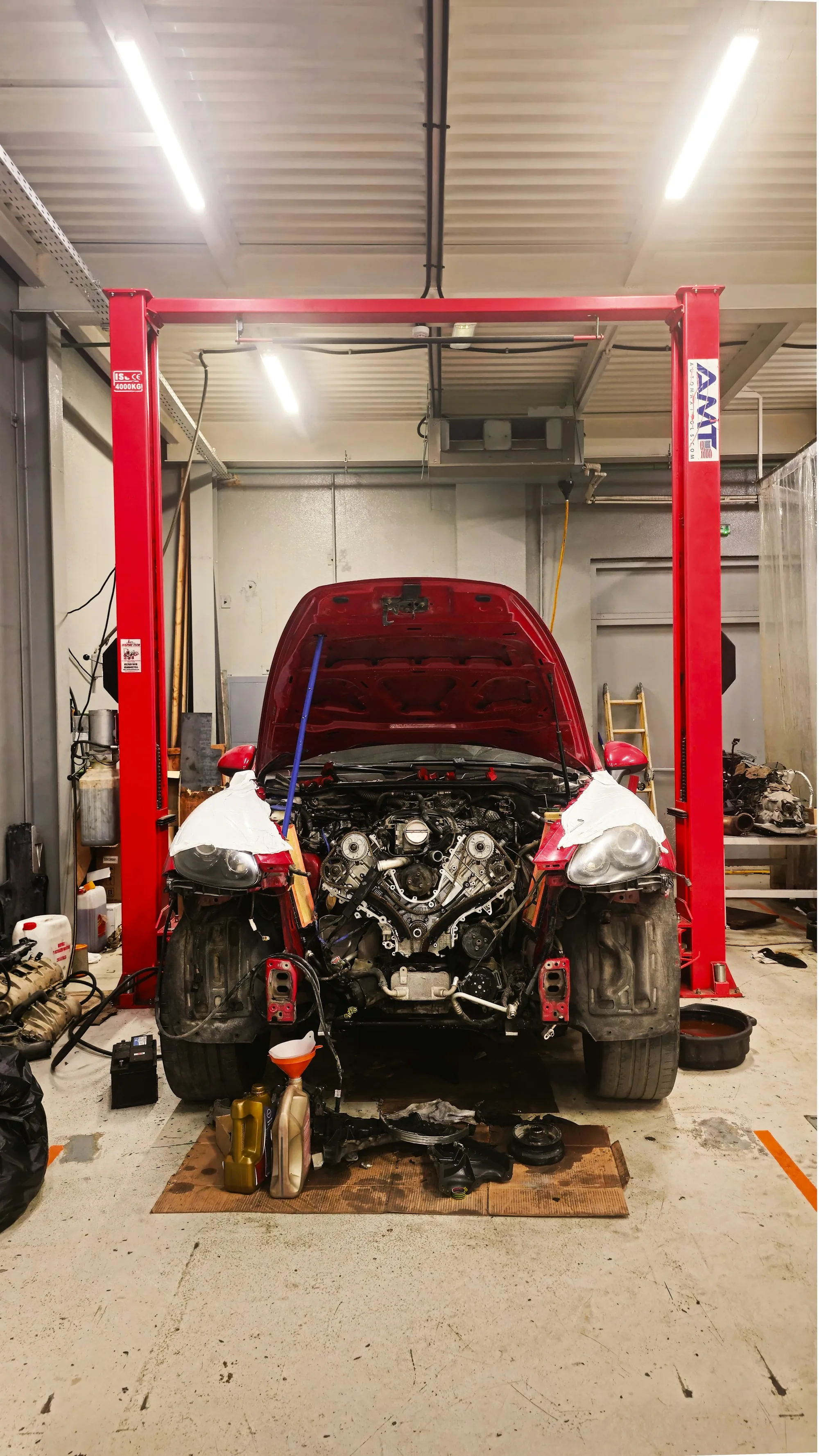 Mechanic inspecting the engine bay of a car