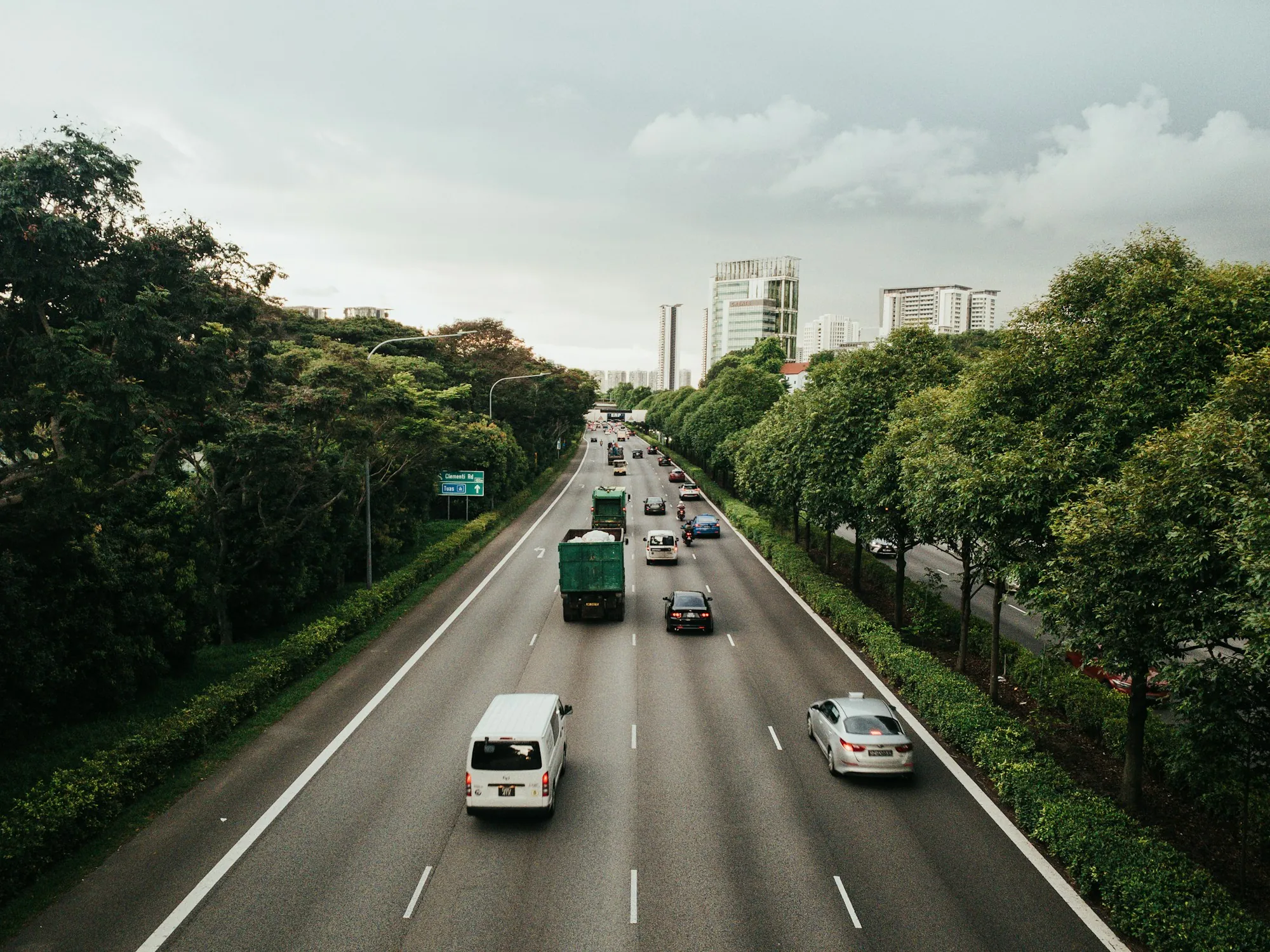 Highway lanes at sunset with light traffic
